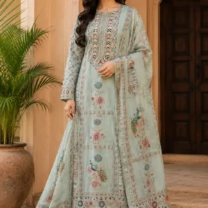Powder-mint Morbagh silk suit styled on a model with printed neckline, floral motifs, peacock dupatta and plain rayon bottom